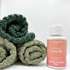 Coccole next to towels on white background by aROMA Laundry  