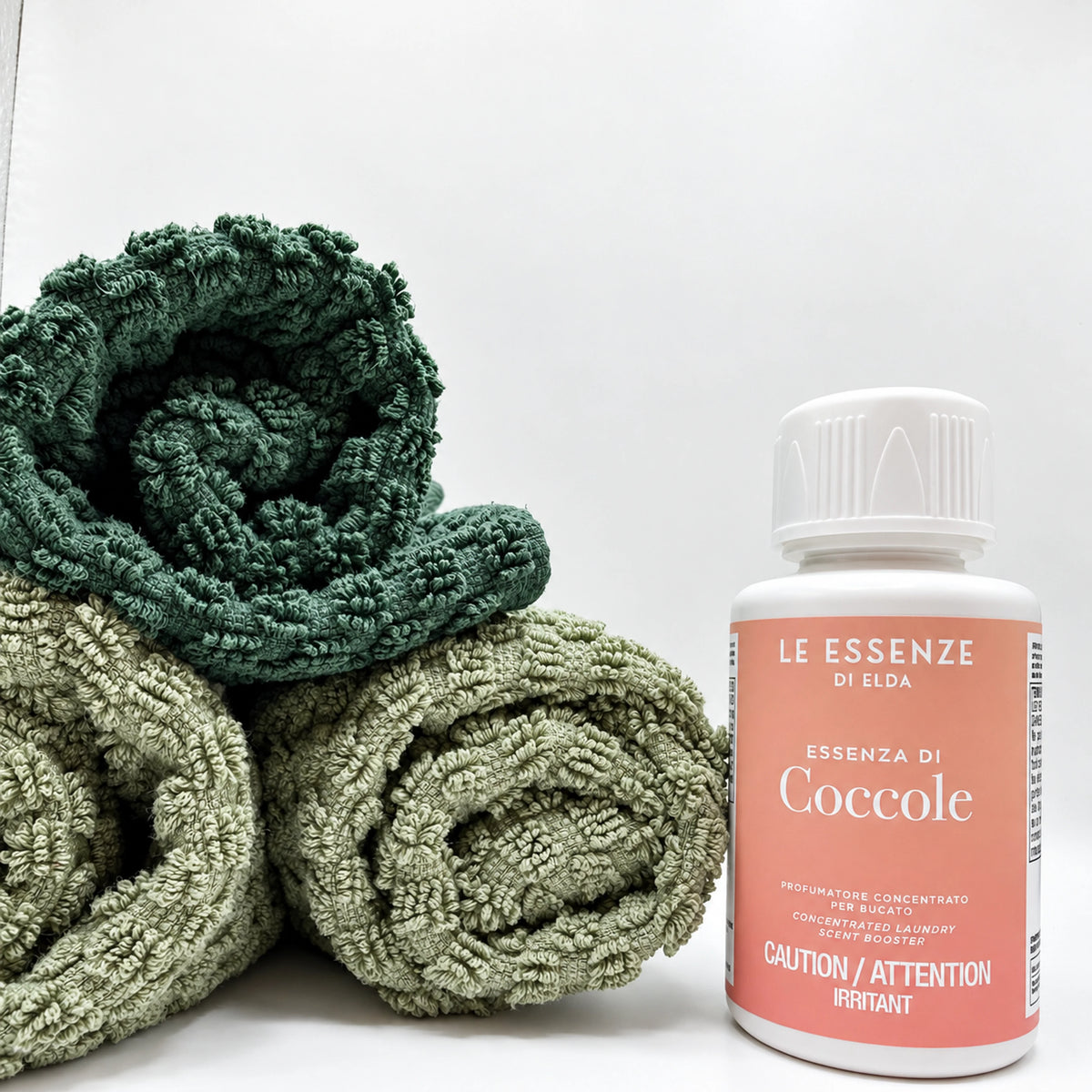 Coccole next to towels on white background by aROMA Laundry  
