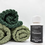 Diamante scent booster 100ml next to towels on white background by aROMA Laundry.
